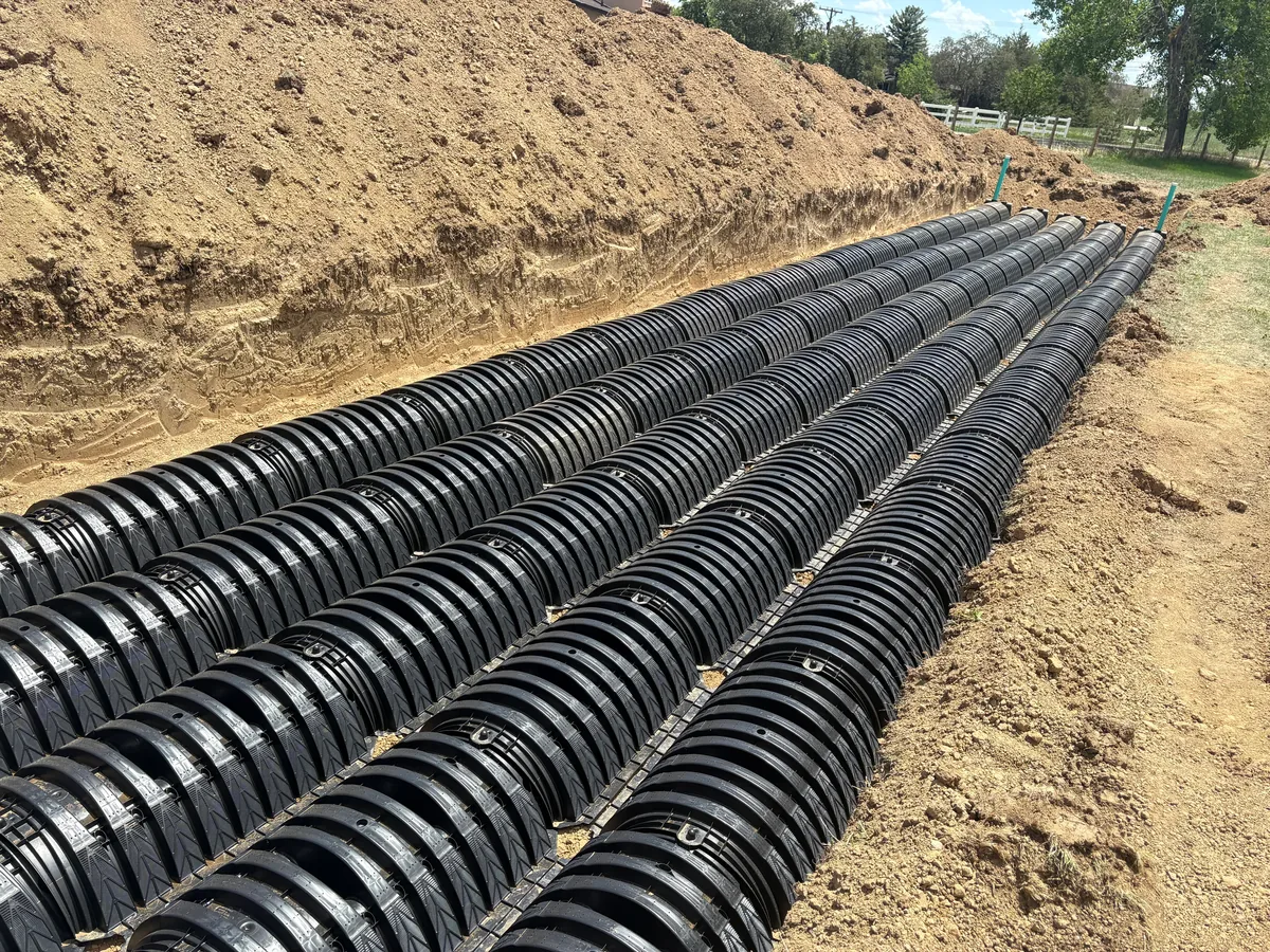 Rows of new drain field chambers laid in open trenches